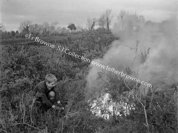 BOY LIGHTING BONFIRE